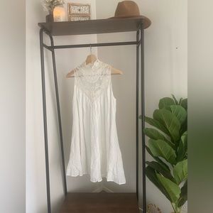 Never worn, white bridal mini dress with crochet high neck. Size Small